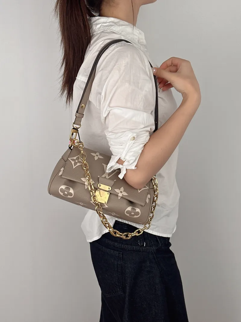 Louis Vuitton Crossbody Bag Favorite Empreinte Embossed Calfskin Medium24 × 9 × 14 cm — on-model view 3 of 3