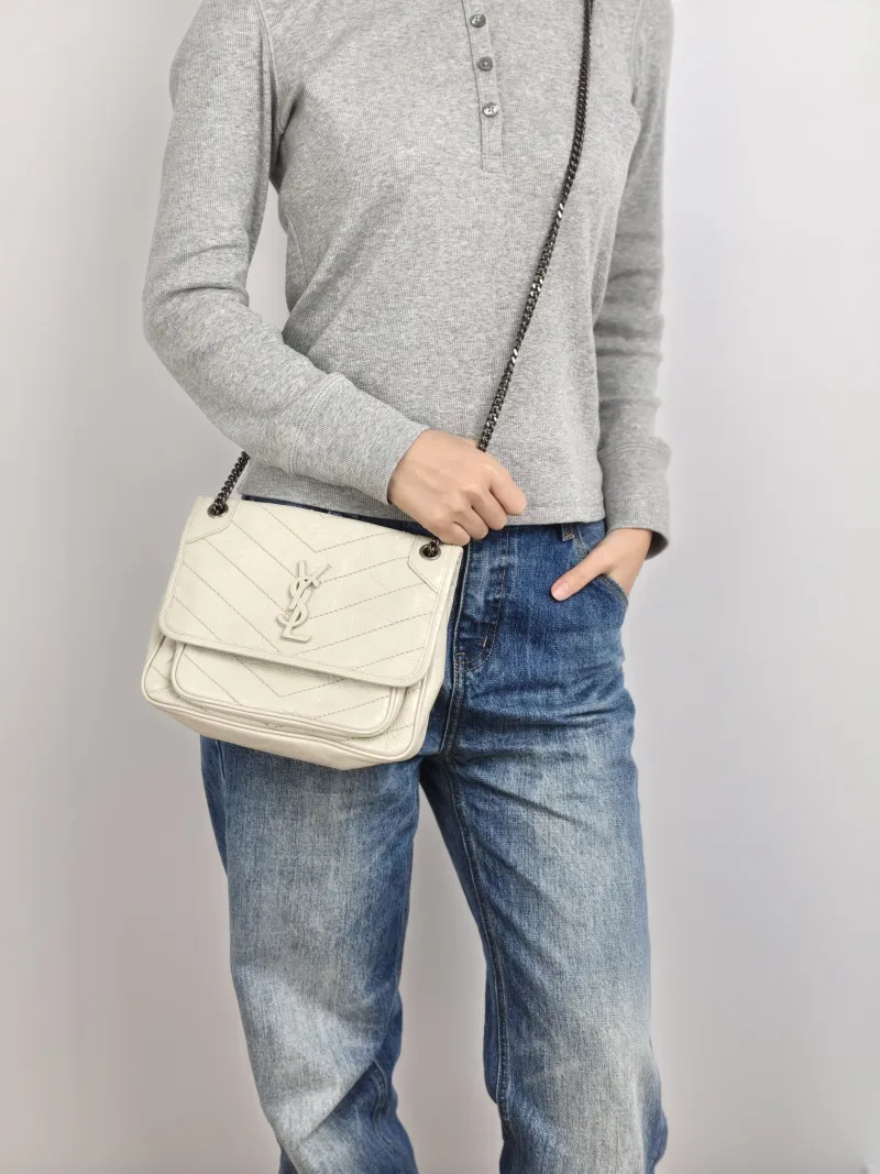 SAINT LAURENT Crossbody Bag Niki D Calfskin Small 21 × 7.5 × 16 cm — on-model view 2 of 2