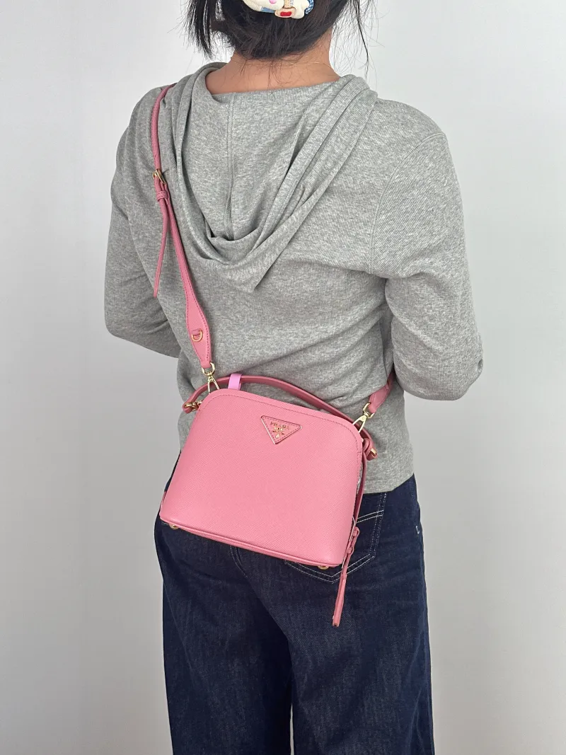 PRADA Crossbody Bag Top Handle Crossbody Bag Calfskin One Size 21 × 10 × 17 cm — on-model view 1 of 2