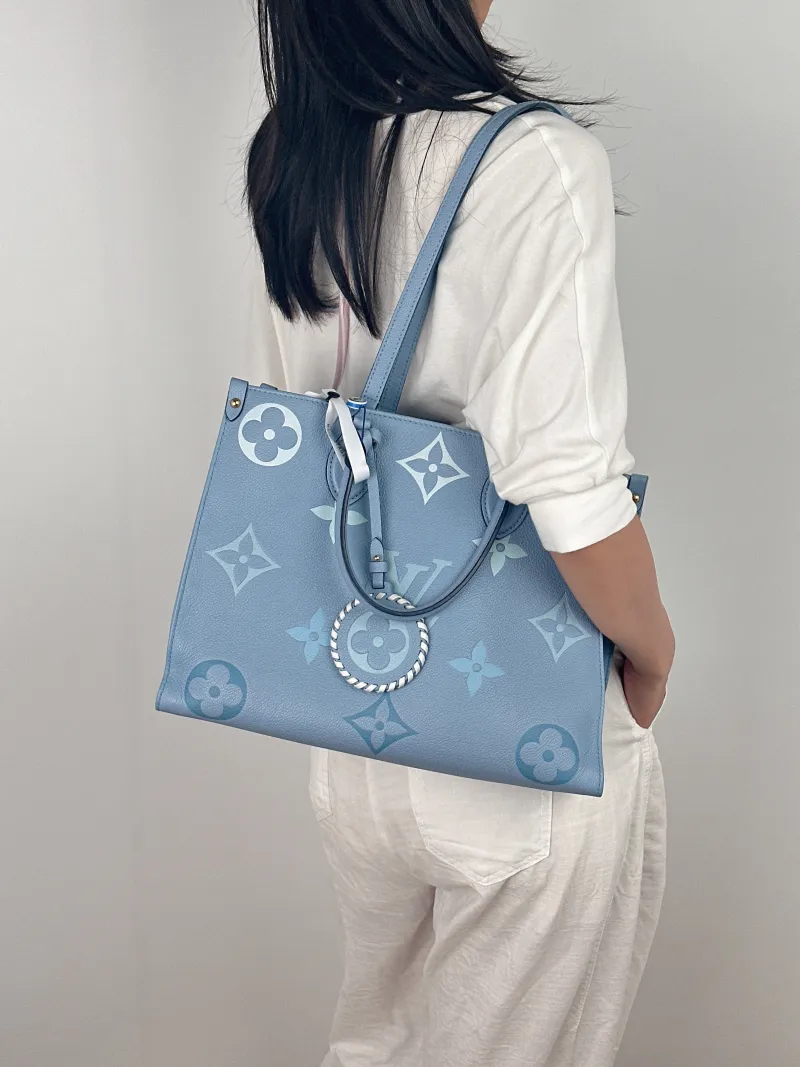 Louis Vuitton Shoulder Bag Onthego Medium Blue Monogram Empreinte Embossed Calfskin Medium35 × 14 × 27 cm — on-model view 1 of 2