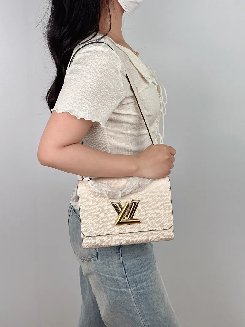 Louis Vuitton Crossbody Bag Twist White Epi Embossed Calfskin Medium 23 × 9.5 × 17 cm — on-model view 1 of 2