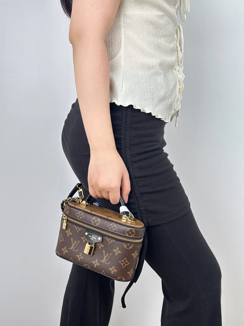 Louis Vuitton Shoulder Bag VANITY POUCH Cosmetic Bag Monogram PVC One Size19 × 6.5 × 11.5 cm — on-model view 1 of 3