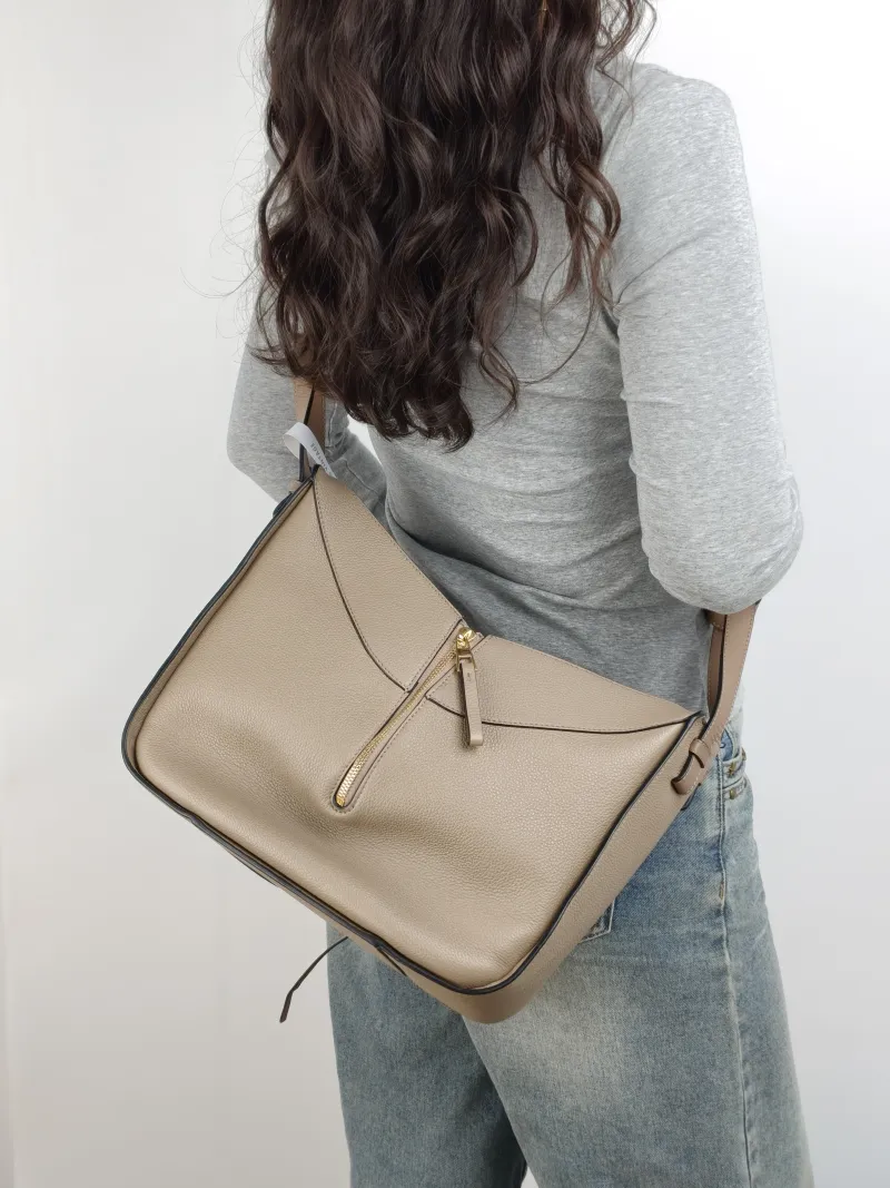 LOEWE Shoulder Bag Hammock Calfskin Small 30 × 14 × 25 cm — on-model view 1 of 2