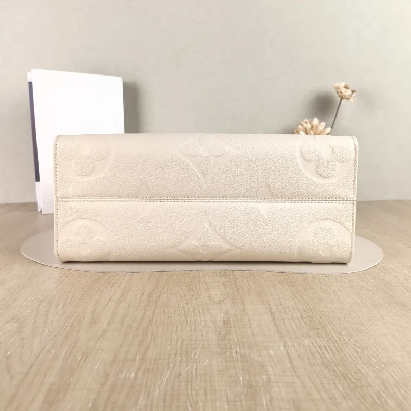 Louis Vuitton Shoulder Bag Onthego Medium White Monogram Empreinte Embossed Calfskin Medium 35 × 14 × 27 cm — cover view 2 of 4