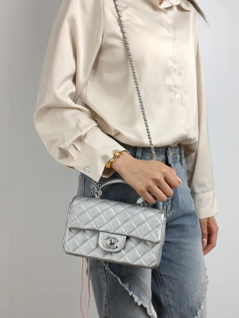 Chanel Crossbody Bag mini Silver Grained Calfskin mini 20 × 6 × 12 cm 30 — on-model view 1 of 3