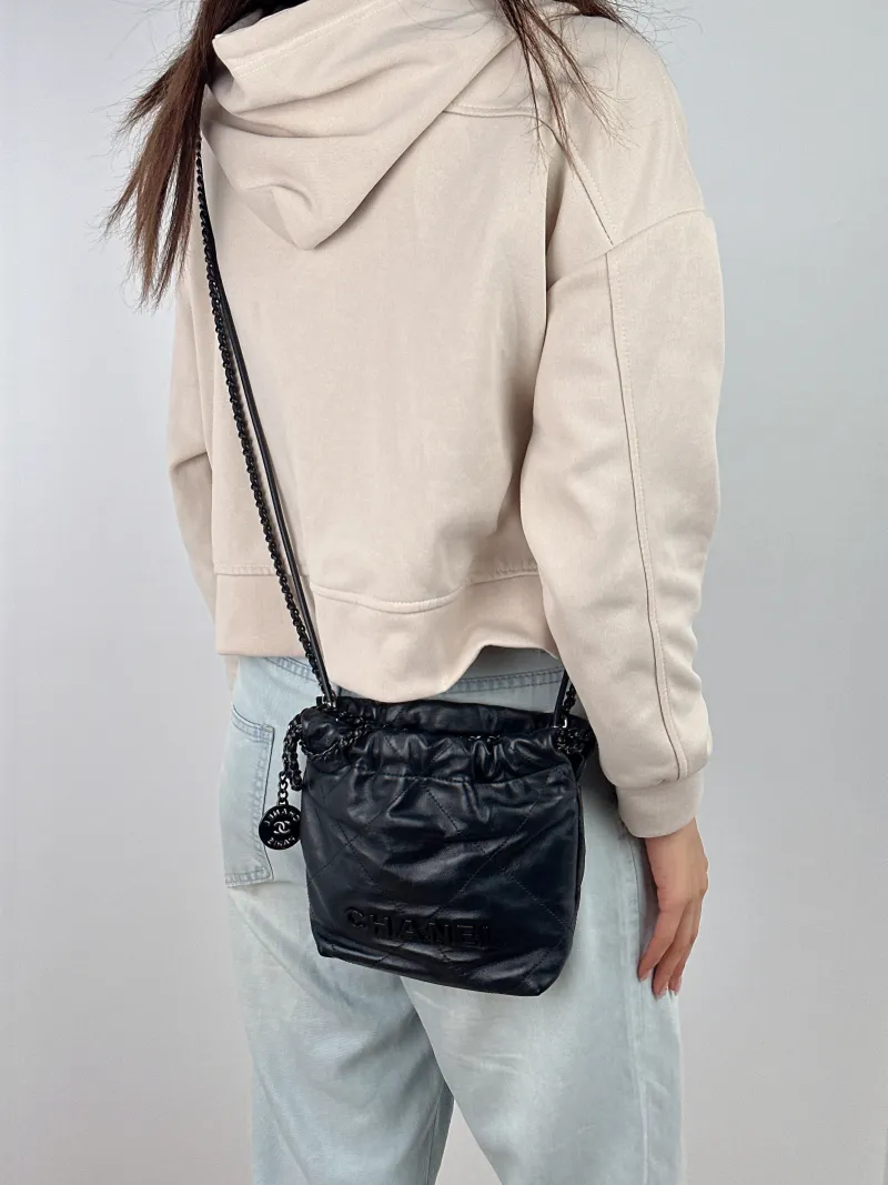 Chanel Shoulder Bag22Bag Black CC alfskinmini20 × 6 × 19 cm — on-model view 1 of 2