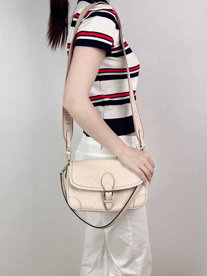 Louis Vuitton Crossbody Bag Diane Baguette Bag White Monogram Empreinte Embossed Calfskin Small 24 × 9 × 15 cm — on-model view 2 of 3