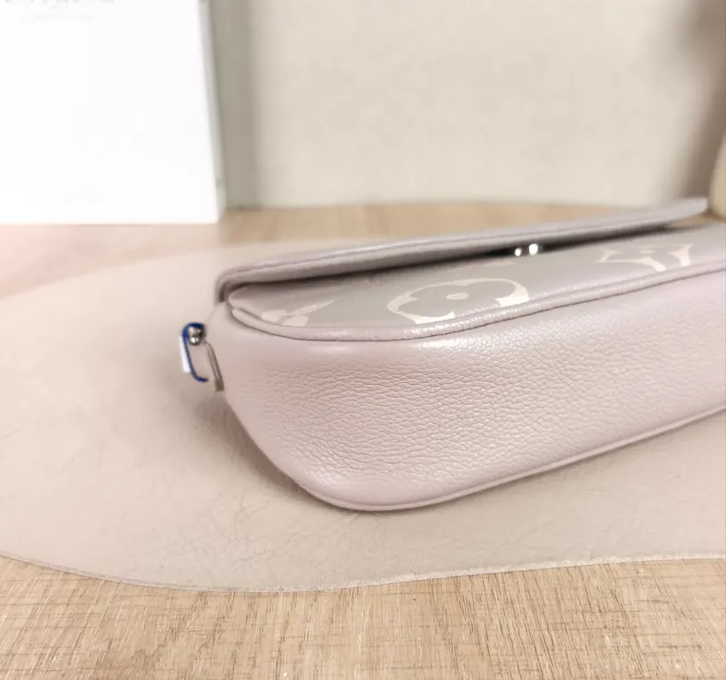 Louis Vuitton Crossbody Bag IVY Grey · White Monogram Empreinte Embossed Calfskin Small 23.5 × 4.3 × 12 cm — detail view 2 of 11