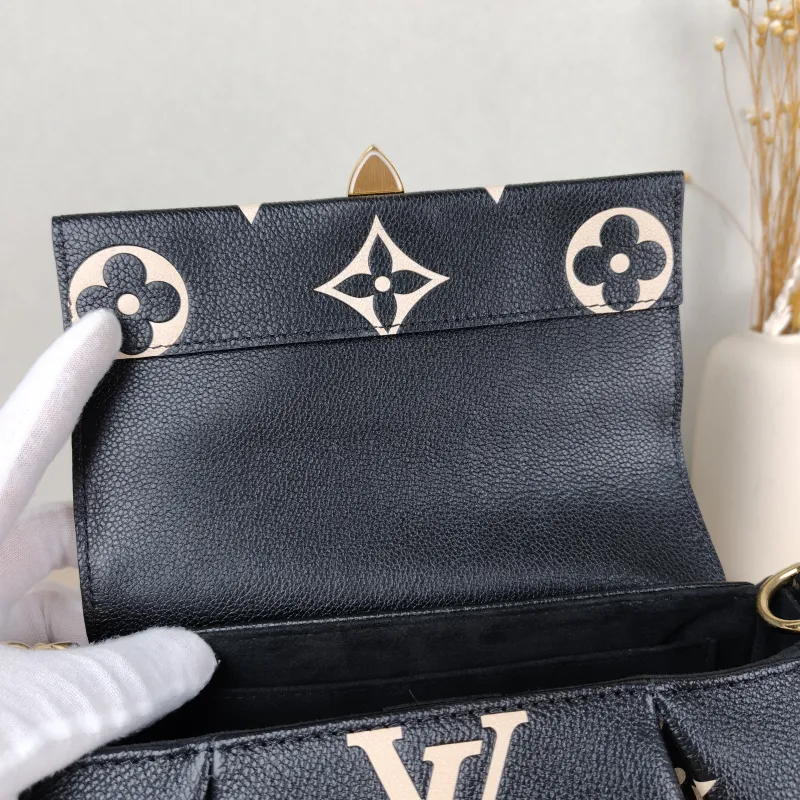 Louis Vuitton Crossbody Bag Favorite Black · White Empreinte Embossed Calfskin Medium 24 × 9 × 14 cm — detail view 1 of 12