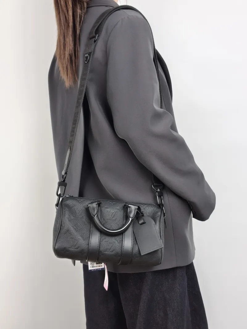 Louis Vuitton Crossbody Bag Keepall 25 Taurillon Monogram Embossed Calfskin Medium 25 × 11 × 15 cm — on-model view 2 of 3