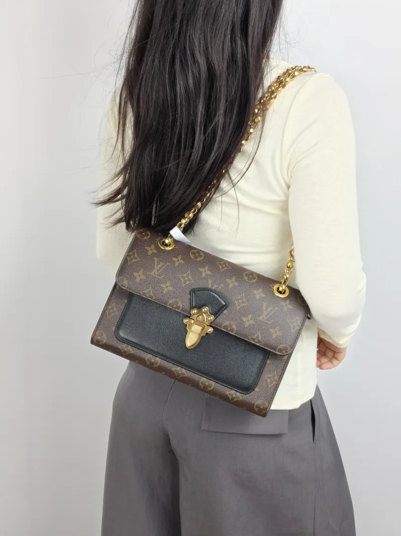 Louis Vuitton Crossbody Bag VICTOIRE Monogram PVC 27 × 10 × 17 cm — on-model view 2 of 2