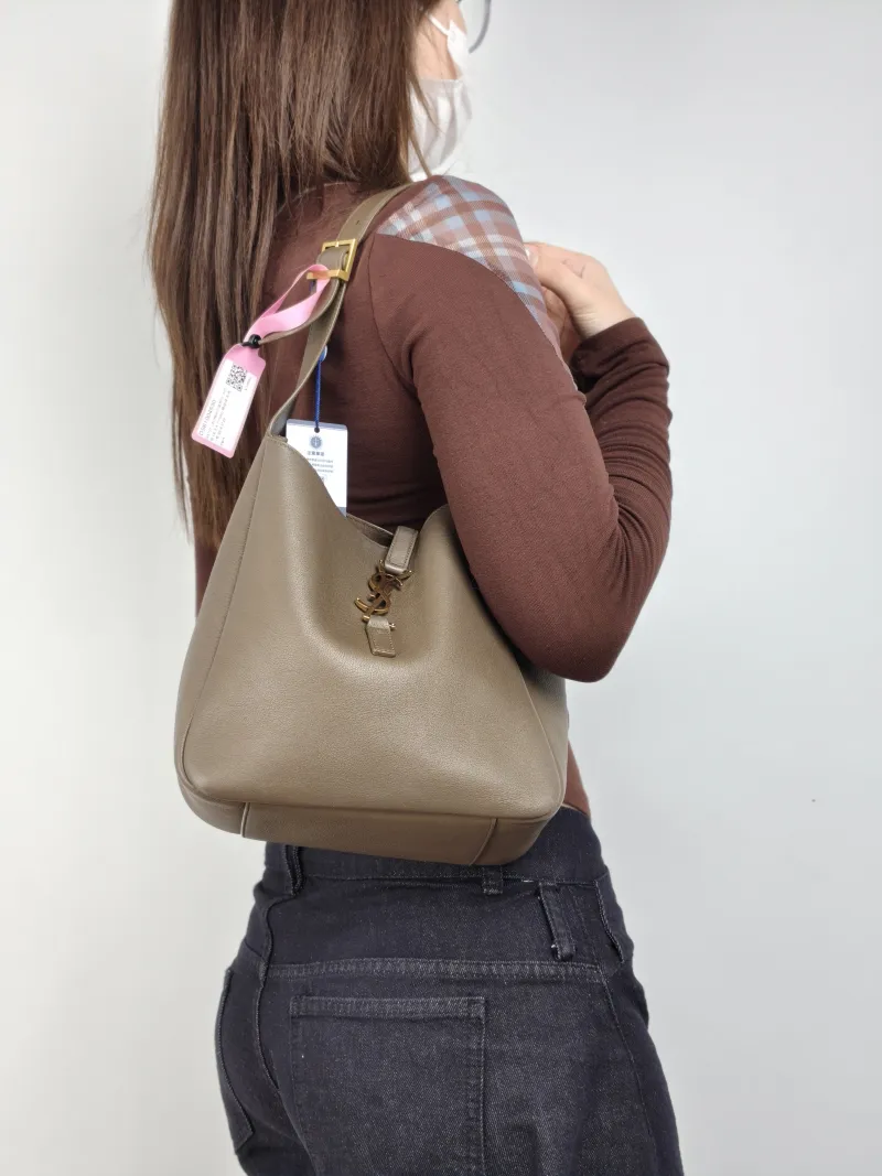 SAINT LAURENT Shoulder Bag LE 5 À 7 Hobo Calfskin Small 22 × 8.5 × 23 cm — on-model view 2 of 2