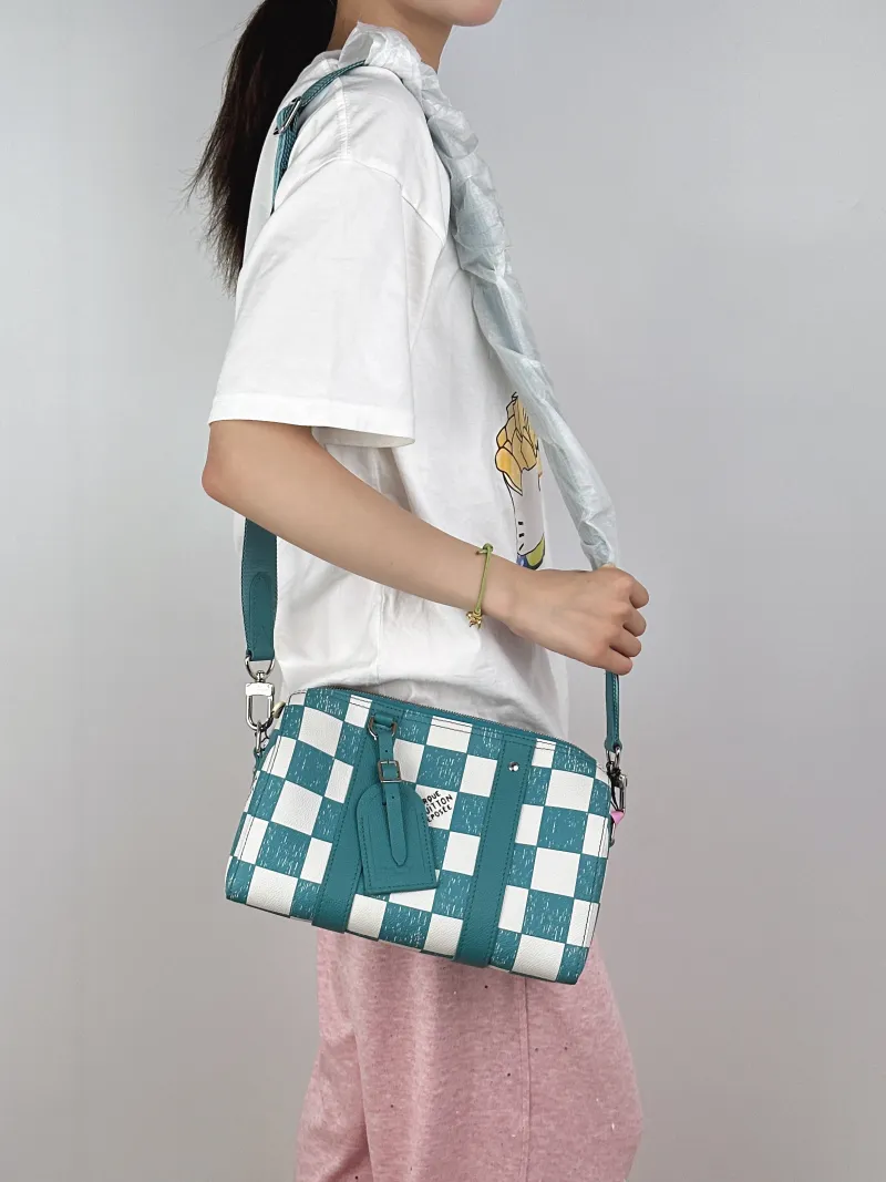 Louis Vuitton Crossbody Bag City Keepall Green · White Calfskin Medium27 × 13 × 17 cm — on-model view 2 of 2
