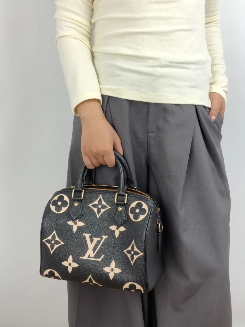 Louis Vuitton Crossbody Bag Speedy25 Black · White Monogram Empreinte Embossed Calfskin Medium 25 × 15 × 19 cm — on-model view 3 of 3