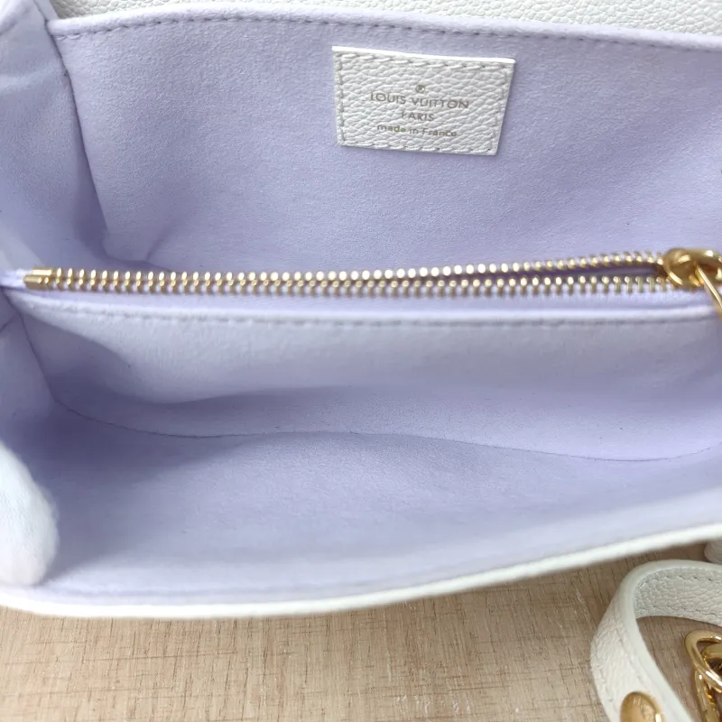 Louis Vuitton Crossbody Bag Pochette Métis East West White · Monogram Empreinte Embossed Calfskin Small 21.5 × 6 × 13.5 cm — detail view 2 of 14