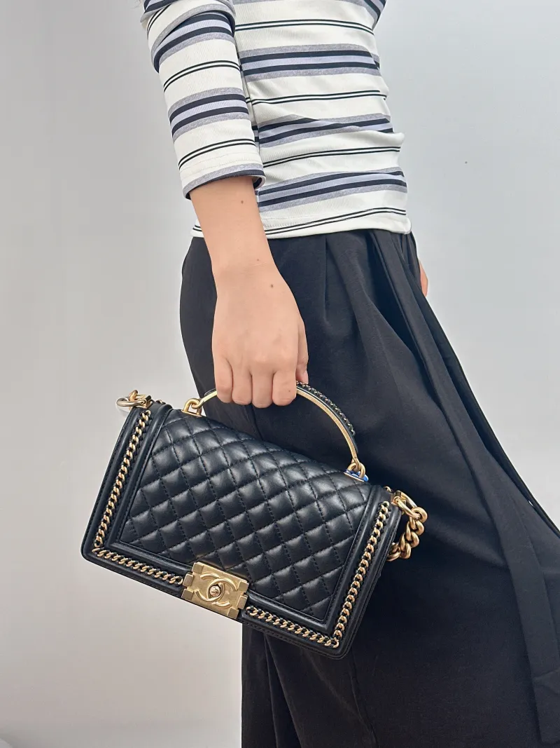Chanel Crossbody Bag le boy Black Calfskin Medium 25 × 9 × 15 cm — on-model view 1 of 2