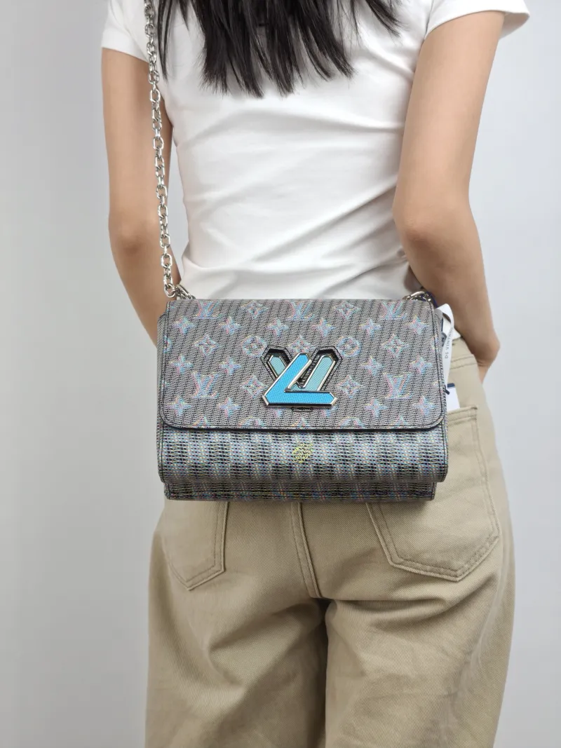 Louis Vuitton Crossbody Bag Twist Blue PVC Medium 23 × 9.5 × 17 cm — on-model view 2 of 2