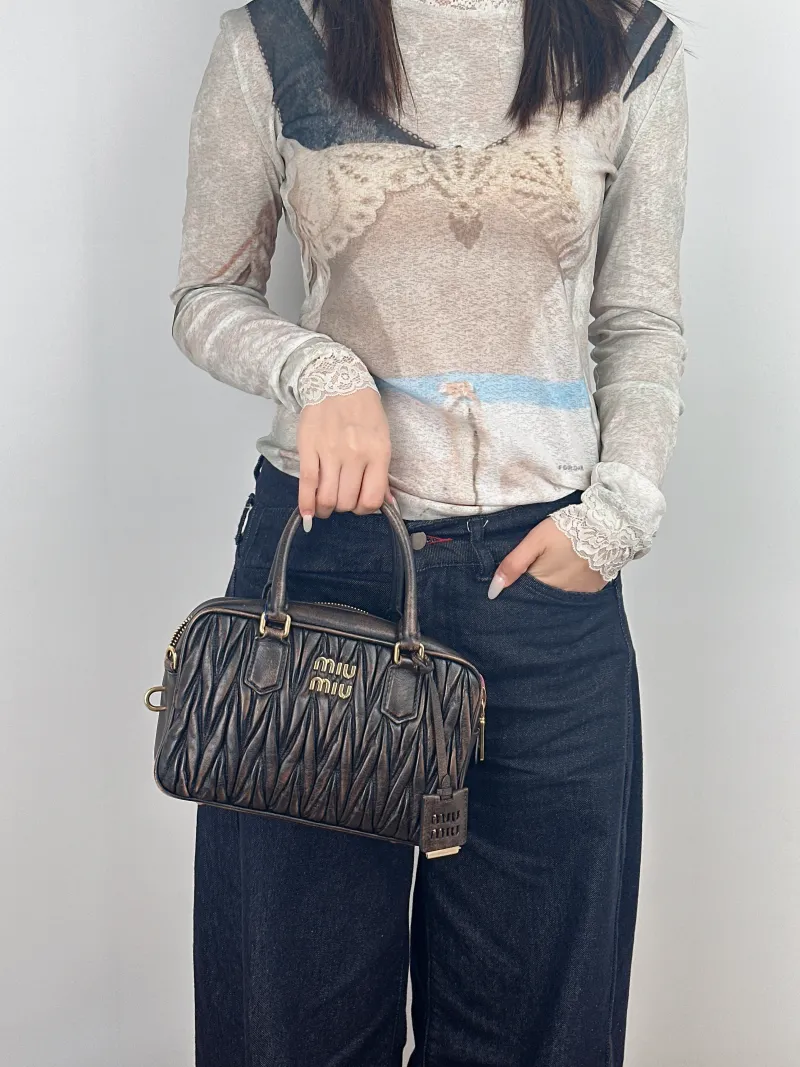 Miumiu Top Handle Bag Arcadie MatelasséCollection Edition Lambskin 25 × 8 × 15.5 cm — on-model view 2 of 2