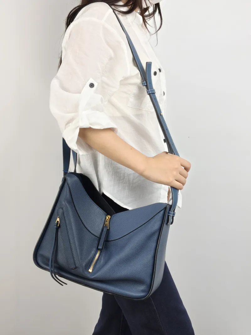 LOEWE Crossbody Bag Hammock Navy Calfskin Medium 29 × 14 × 32 cm — on-model view 1 of 2