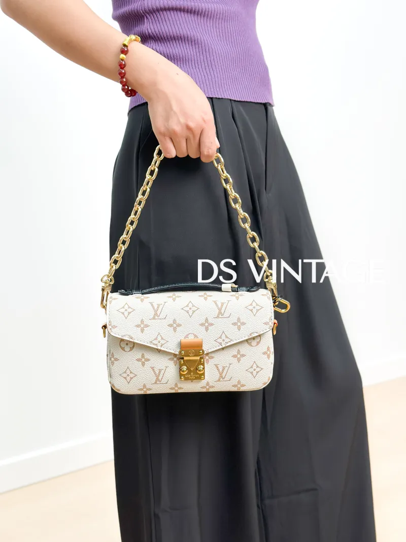 Louis Vuitton Crossbody Bag Pochette Métis East West PVC Small 21.5 × 6 × 13.5 cm — on-model view 3 of 4
