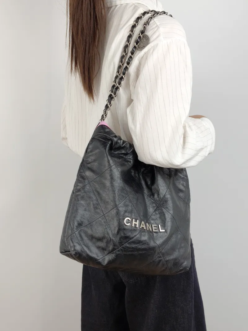 Chanel Shoulder Bag 22Bag Black CC alfskin Small 35 × 7 × 37 cm — on-model view 1 of 2