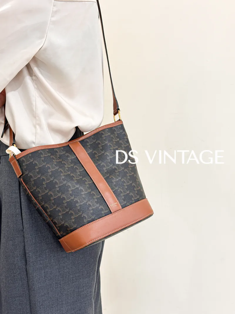 CELINE Crossbody Bag Triomphe Bucket Bag Monogram PVC Small22 × 13 × 26 cm — on-model view 1 of 3