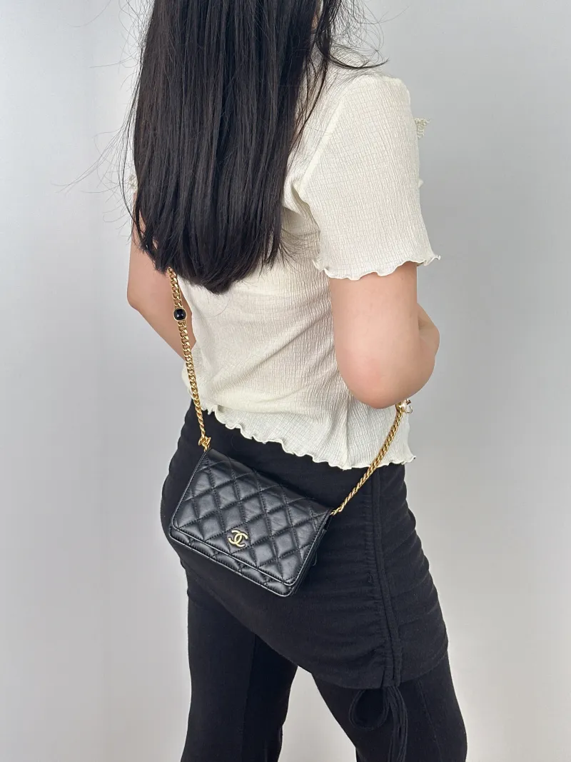Chanel Crossbody Bag woc Black Lambskin One Size15.5 × 5 × 11 cm — on-model view 1 of 2