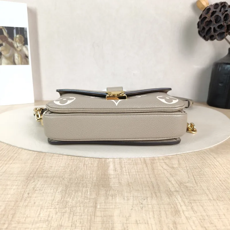 Louis Vuitton Crossbody Bag Pochette Métis East West Monogram Empreinte Embossed Calfskin Small 21.5 × 6 × 13.5 cm — cover view 6 of 6