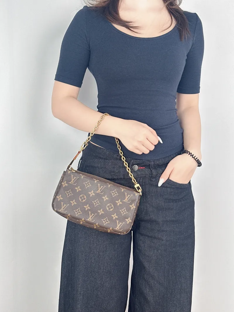 Louis Vuitton Shoulder Bag Pochette Accessoires Monogram PVC One Size22 × 4 × 13 cm — on-model view 1 of 2