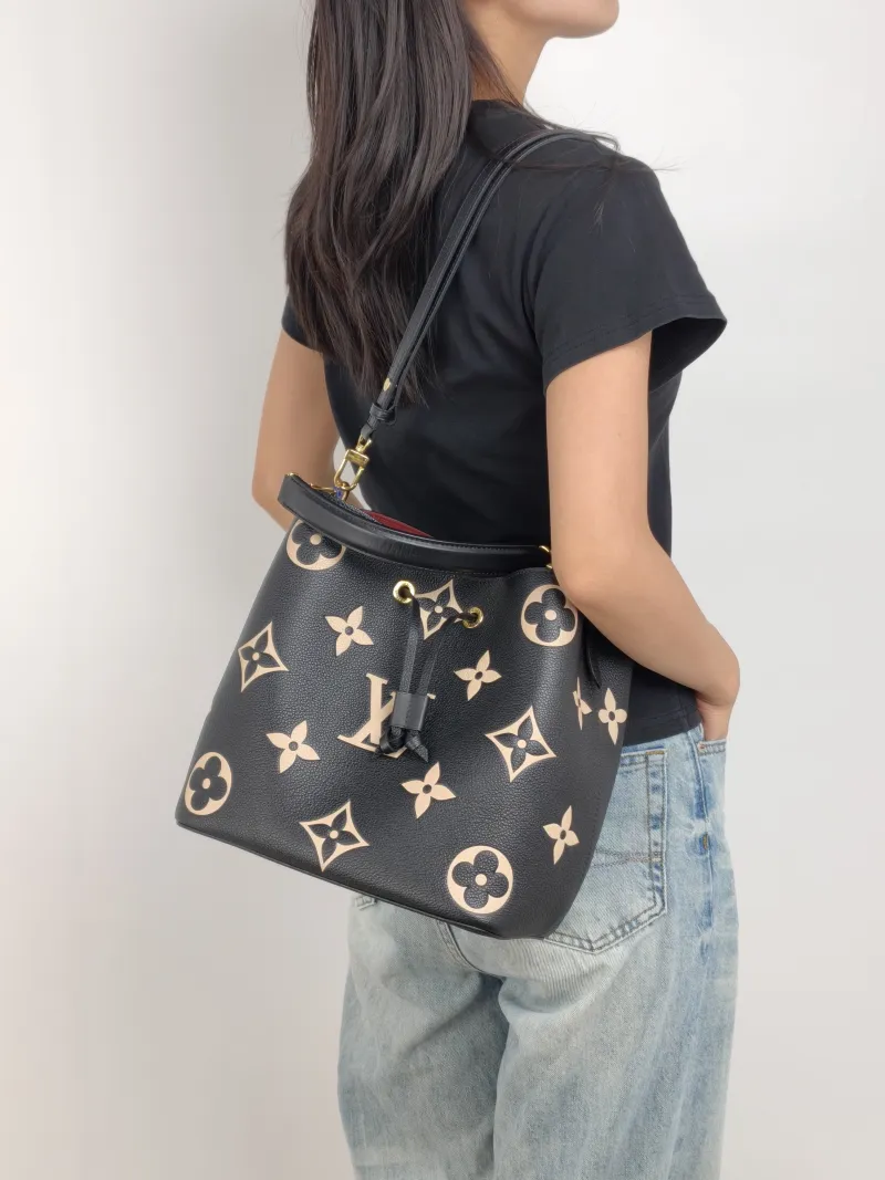 Louis Vuitton Shoulder Bag NÉONOÉ Bucket Bag Black · White Monogram Empreinte Embossed Calfskin Medium 26 × 17.5 × 26 cm — on-model view 2 of 3