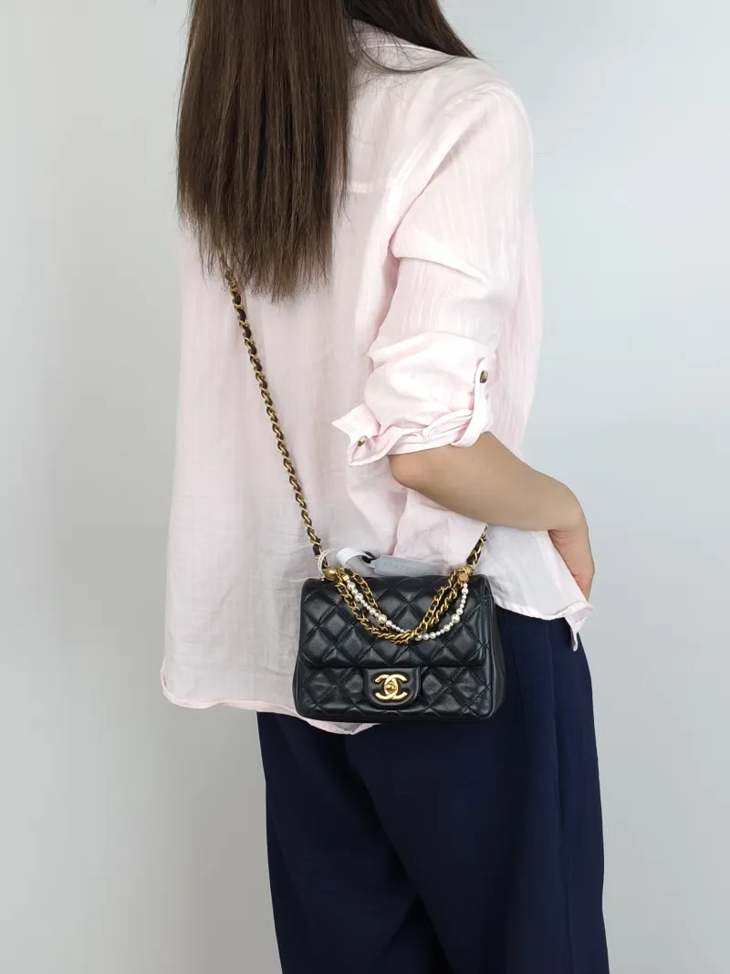 Chanel Crossbody Bag24p Pearl Black Lambskinmini17 × 5 × 12.5 cm — on-model view 3 of 3
