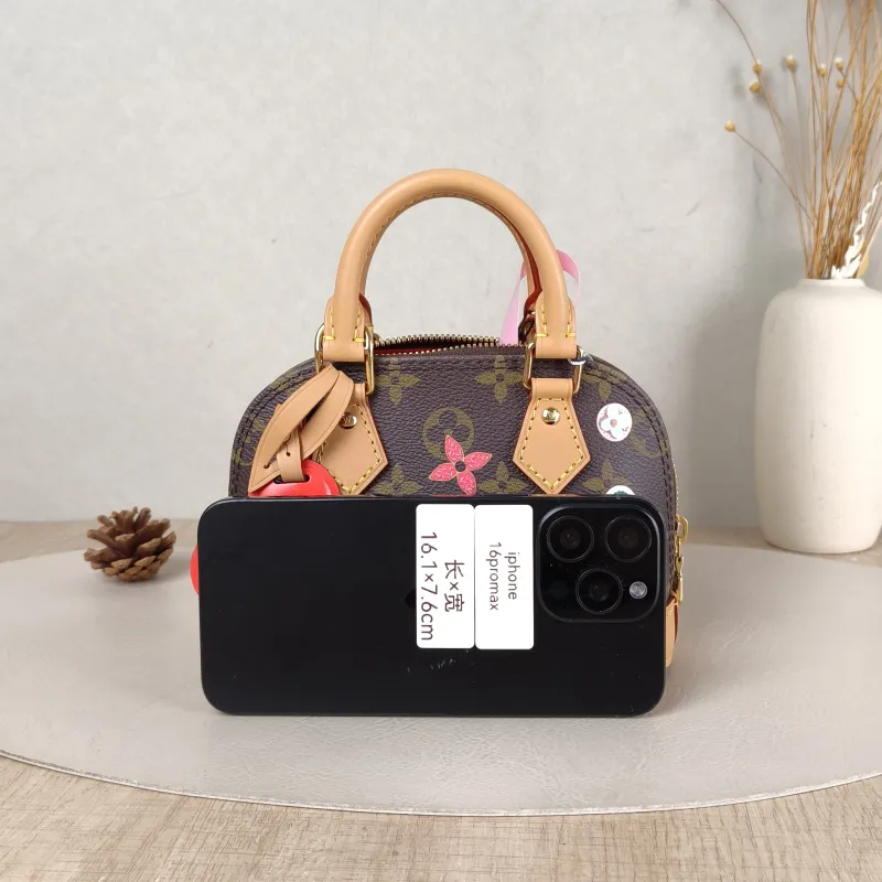 Louis Vuitton Crossbody Bag Alma Nano vivenne Monogram PVC nano 18 × 8 × 12 cm — cover view 2 of 5