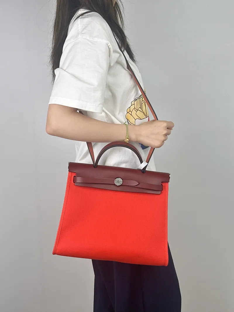 Hermès Crossbody Bag Herbag 319T 55 Calfskin，Canvas Medium30.5 × 11 × 25.5 cm — on-model view 2 of 2