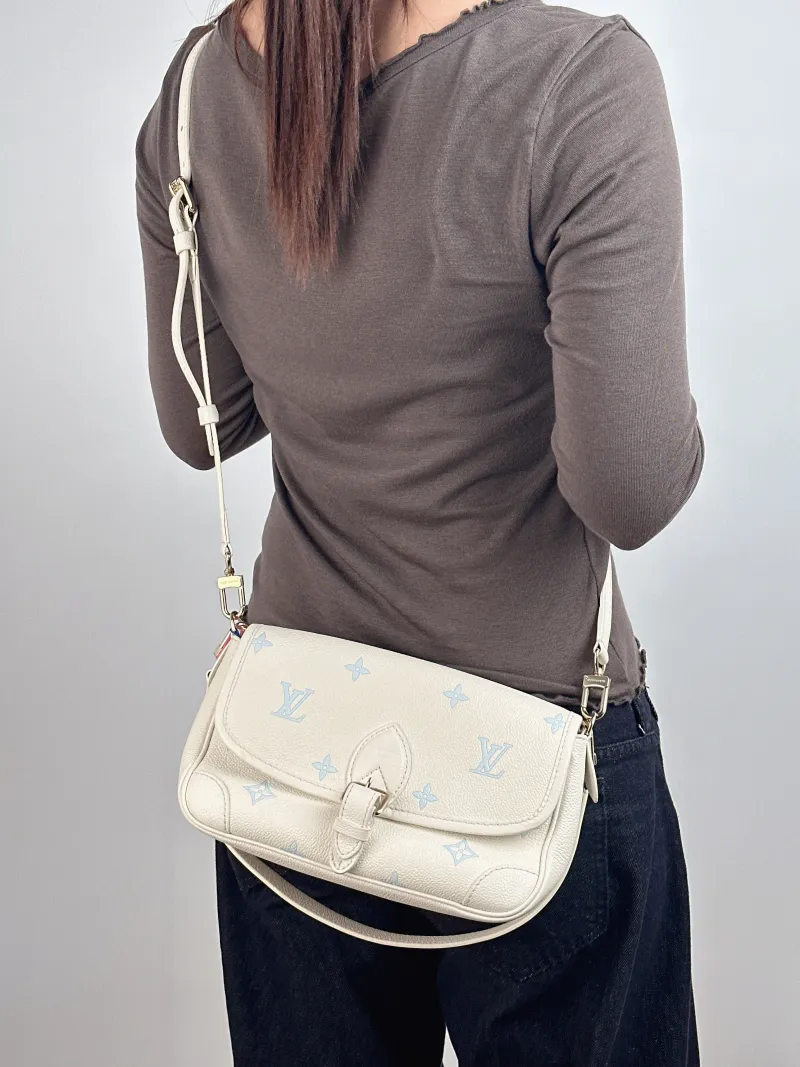 Louis Vuitton Crossbody Bag Diane Baguette Bag White · Blue Empreinte Embossed Calfskin Small 24 × 9 × 15 cm — on-model view 2 of 2