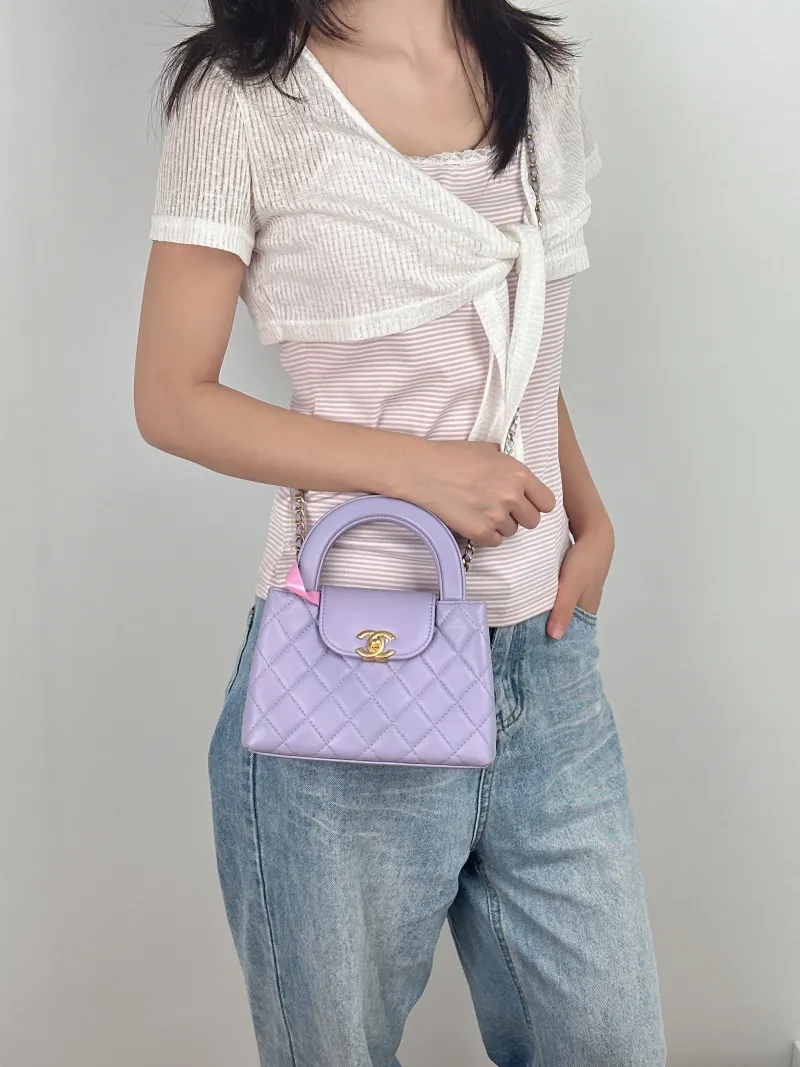 Chanel Crossbody Bag Kelly Lambskin mini19 × 7 × 13 cm — on-model view 2 of 3