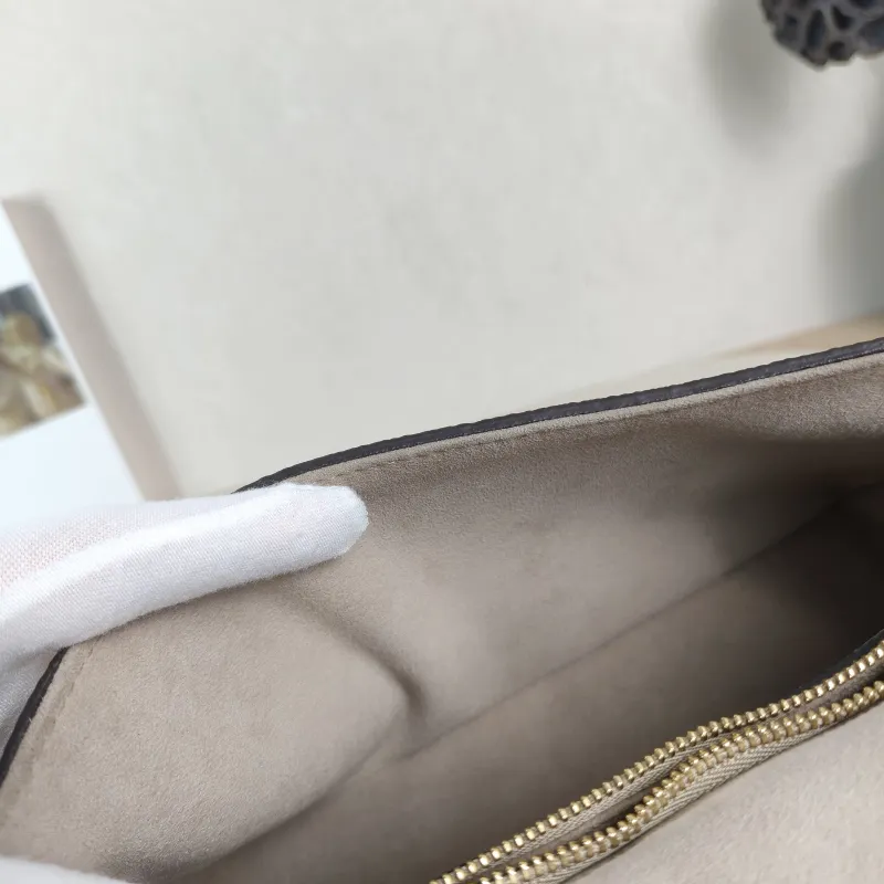 Louis Vuitton Crossbody Bag Diane Baguette Bag Monogram Empreinte Embossed Calfskin Small 24 × 9 × 15 cm — detail view 13 of 13
