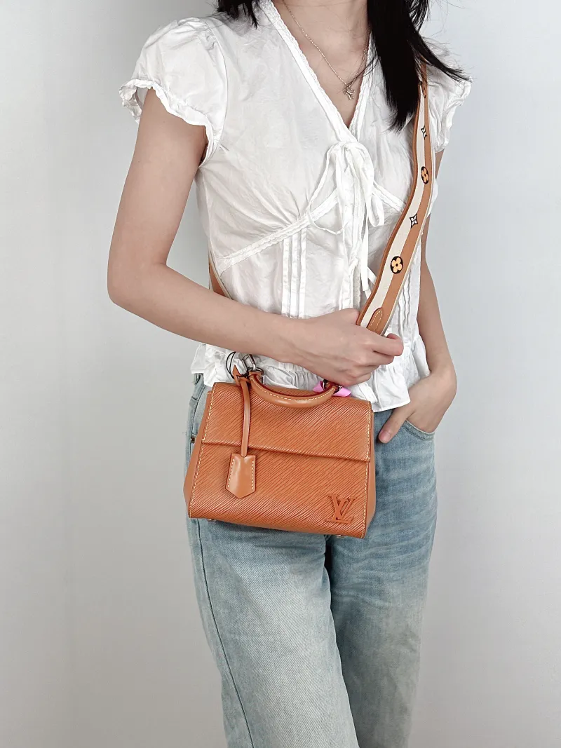 Louis Vuitton Crossbody Bag CLUNY Caramel Epi Embossed Calfskinmini20 × 7.5 × 16 cm — on-model view 1 of 3