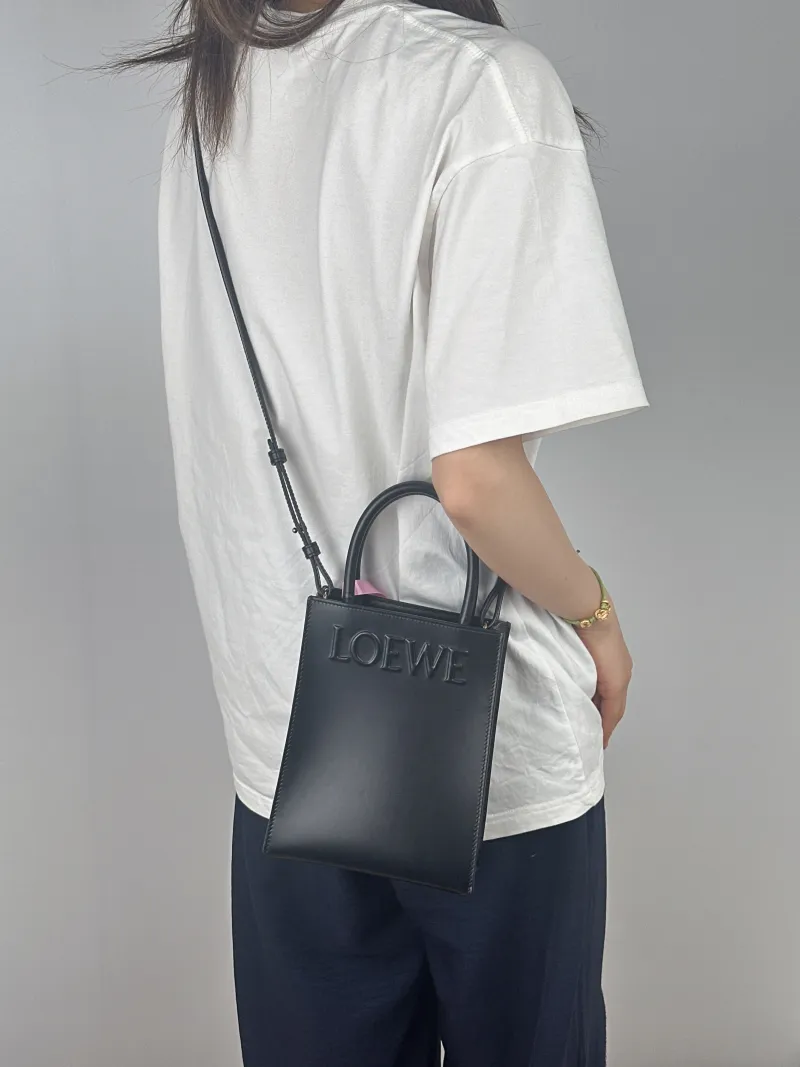 LOEWE Crossbody Bag A5 Tote Black Calfskin One Size17 × 6 × 21 cm — on-model view 1 of 3
