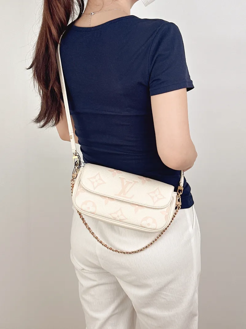 Louis Vuitton Crossbody Bag IVY White · Pink Empreinte Embossed Calfskin Monogram Small23.5 × 4.3 × 12 cm — on-model view 2 of 2