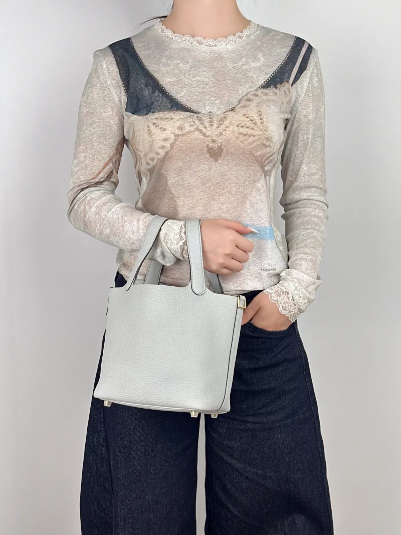 Hermès Top Handle Bag Picotin Lock 18 1808 Taurillon Clemence TC Calfskin Small18 × 13 × 18 cm — on-model view 1 of 2