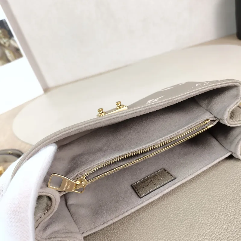 Louis Vuitton Crossbody Bag Pochette Métis East West Monogram Empreinte Embossed Calfskin Small 21.5 × 6 × 13.5 cm — detail view 13 of 13