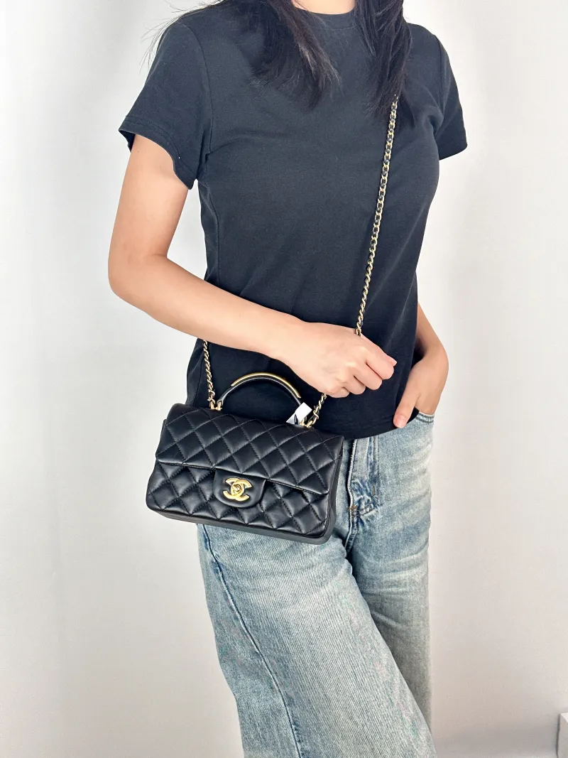 Chanel Crossbody Bag mini Black Lambskin mini20 × 6 × 12 cm — on-model view 1 of 3
