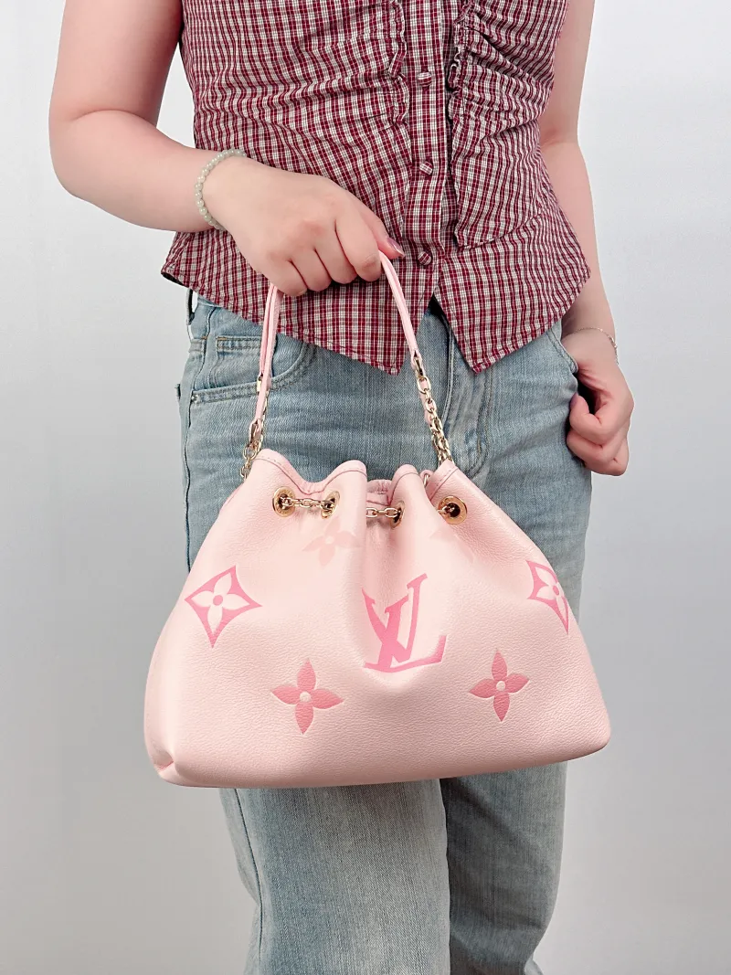 Louis Vuitton Crossbody Bag BUNDLE Pink Monogram Empreinte Embossed Calfskin28 × 11.5 × 20 cm — on-model view 3 of 4