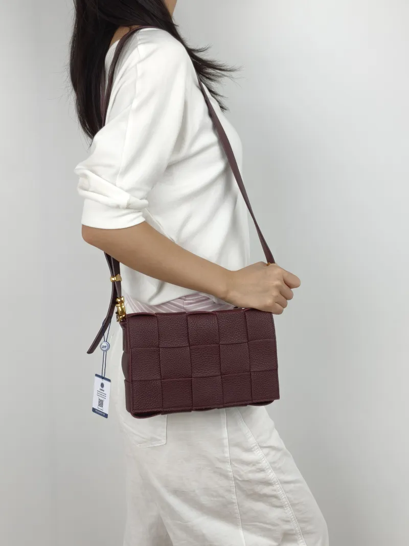 Bottega Veneta Crossbody Bag Cassette Woven Burgundy Calfskin Medium 23 × 5 × 15 cm — on-model view 2 of 2