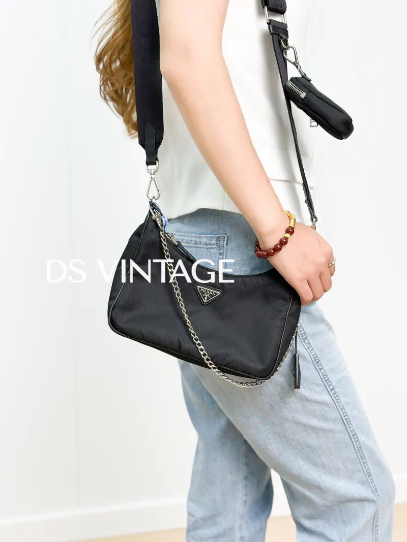 PRADA Crossbody Bag Re-Edition 2005 Hobo Black Nylon Mini 22 × 6 × 18 cm — on-model view 2 of 3