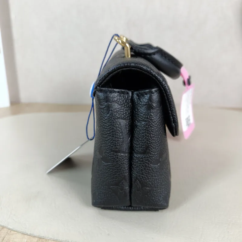 Louis Vuitton Crossbody Bag MADELEINE Black Monogram Empreinte Embossed Calfskin nano 21 × 6 × 12.5 cm — detail view 2 of 12