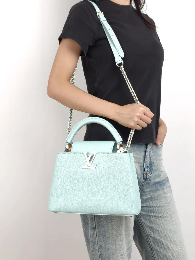 Louis Vuitton Top Handle Bag Capucines Blue Calfskin BB 27 × 9 × 17.5 cm — on-model view 1 of 3