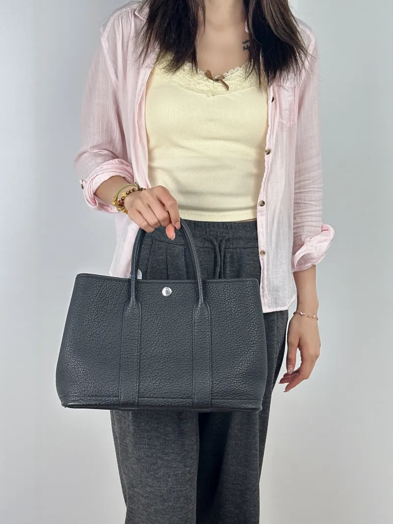 Hermès Top Handle Bag Garden Party 30 30Black Negonda Calfskin Medium30 × 13 × 21 cm — on-model view 2 of 2