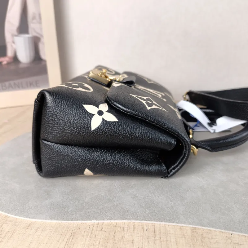 Louis Vuitton Crossbody Bag MADELEINE Black · White Monogram Empreinte Embossed Calfskin BB 24 × 8.5 × 17 cm — detail view 10 of 13