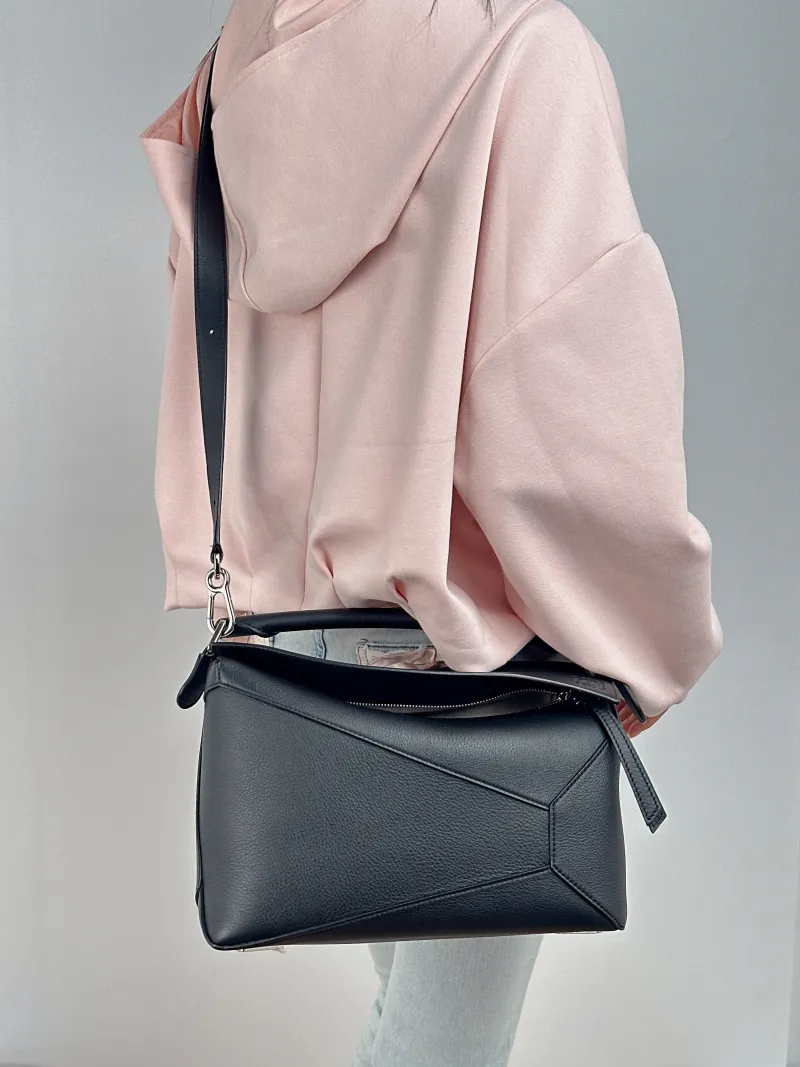 LOEWE Shoulder Bag Puzzle Black CC alfskin Medium 29 × 14 × 19.5 cm — on-model view 1 of 2